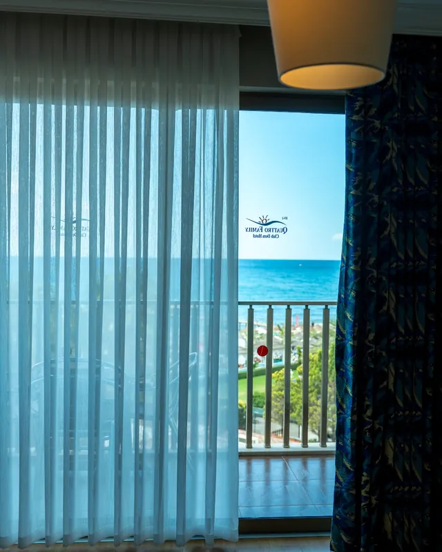Mert Tekstil Alanya — Sheers framing the sea view